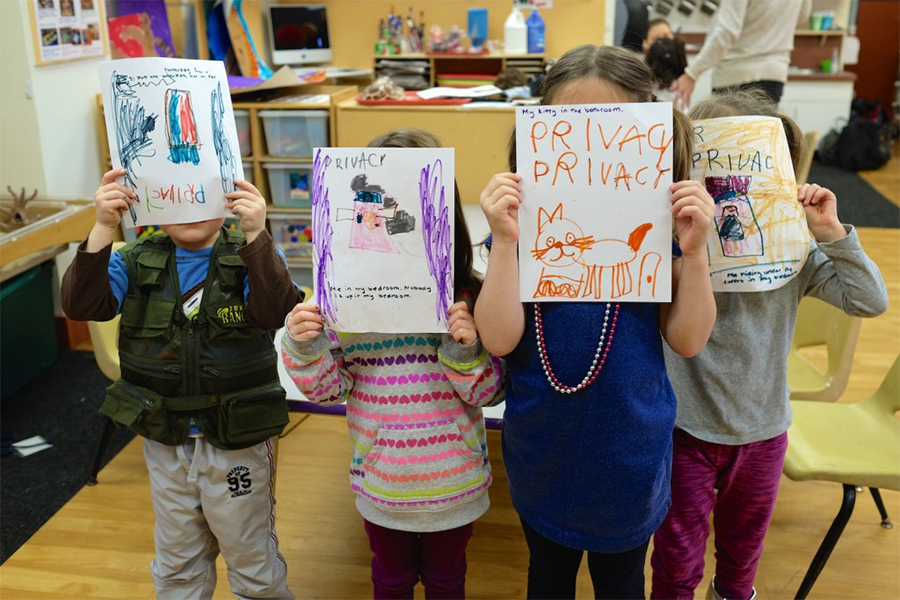 children showing off their illustrations of what privacy means to them